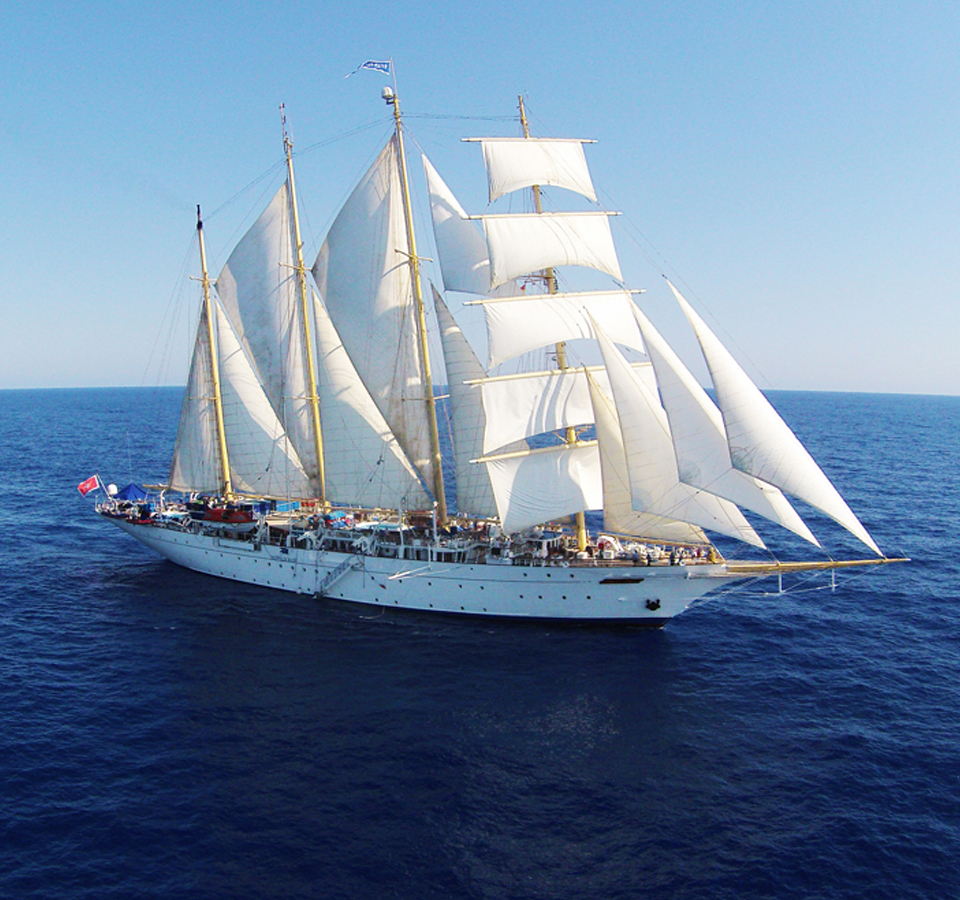 A Star Clippers tall ship under sail on the open ocean